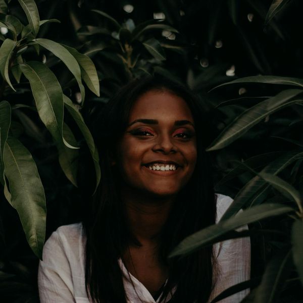 Smiling woman looking refreshed and peaceful after her practice.